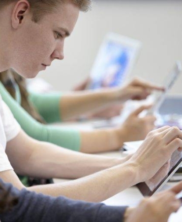 teenagers-using-digital-tablets-classroom-2022-03-07-23-55-55-utc-768x512